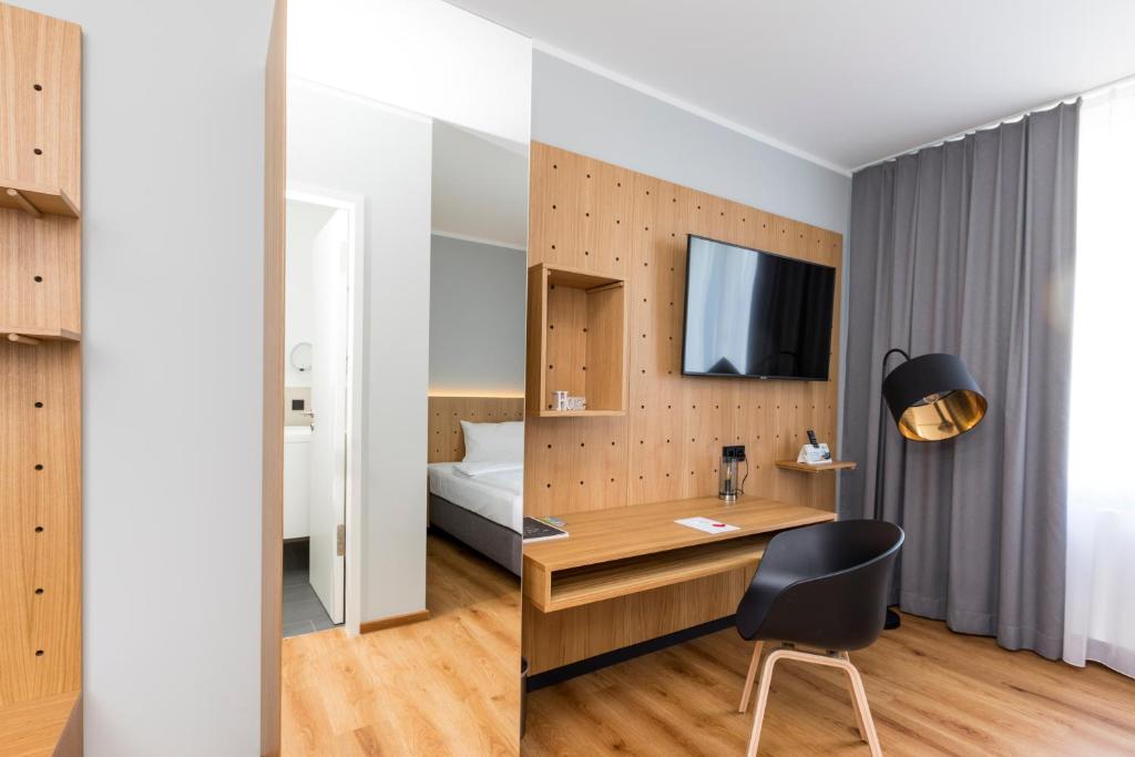TV a/nebo společenská místnost v ubytování mk hotel eschborn