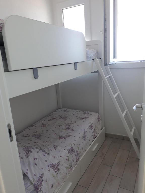 A bed or beds in a room at Barbara's house - Sardinia