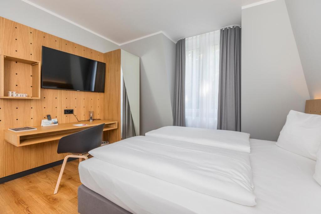 TV a/nebo společenská místnost v ubytování mk hotel eschborn