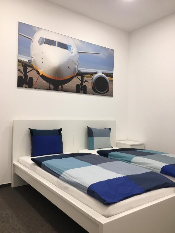 Postel nebo postele na pokoji v ubytování AeroRooms