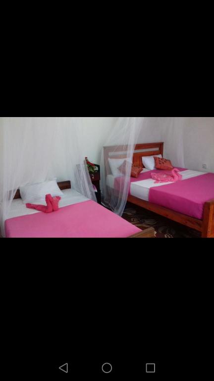 Postel nebo postele na pokoji v ubytování Opal Cottage Ella