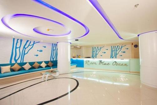 a room with a swimming pool with a ceiling at R-Con Blue Ocean in Pattaya