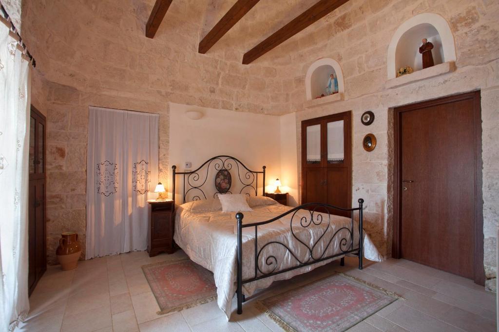 Postel nebo postele na pokoji v ubytování B&B Salita Delle Pere