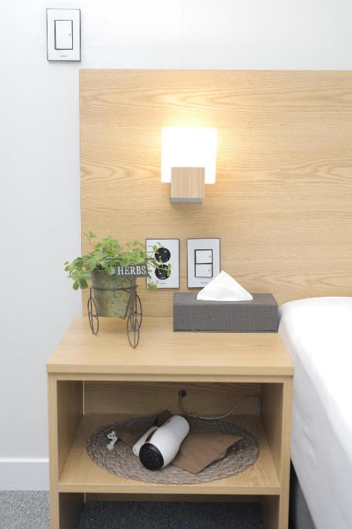 Rúm í herbergi á Line Hotel Myeongdong