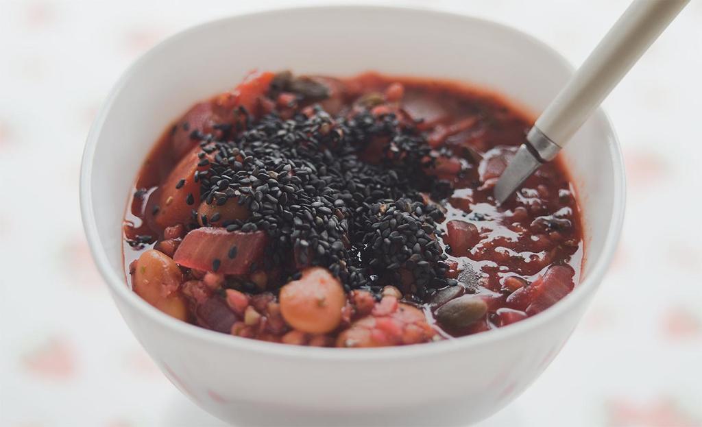 a bowl of chili with a spoon in it at Place for tent - Miejsce na namiot u stóp natury in Kuty