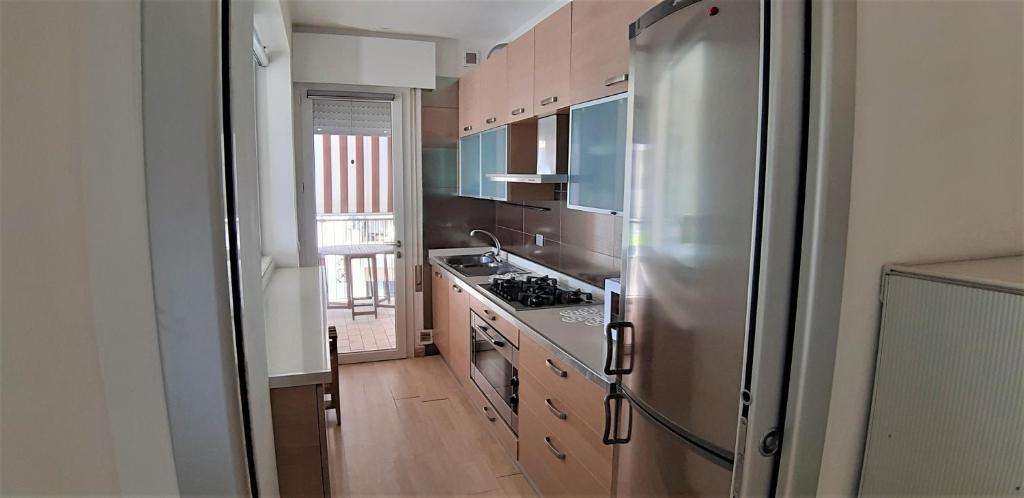 A kitchen or kitchenette at App4rent Augustus Sea View - Family House - wifi&parking - 3 rooms