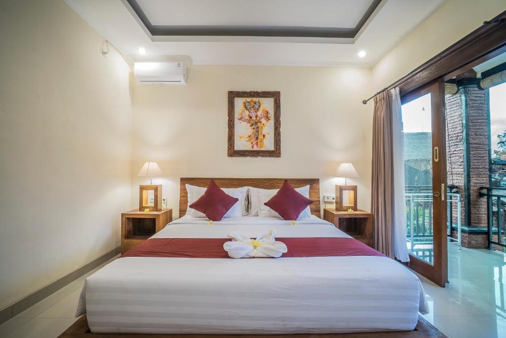 Postel nebo postele na pokoji v ubytování Sriwedari 40 Ubud