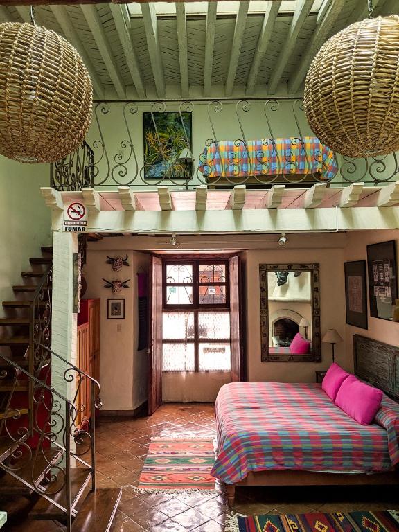 Postel nebo postele na pokoji v ubytování Hotel Casa Encantada