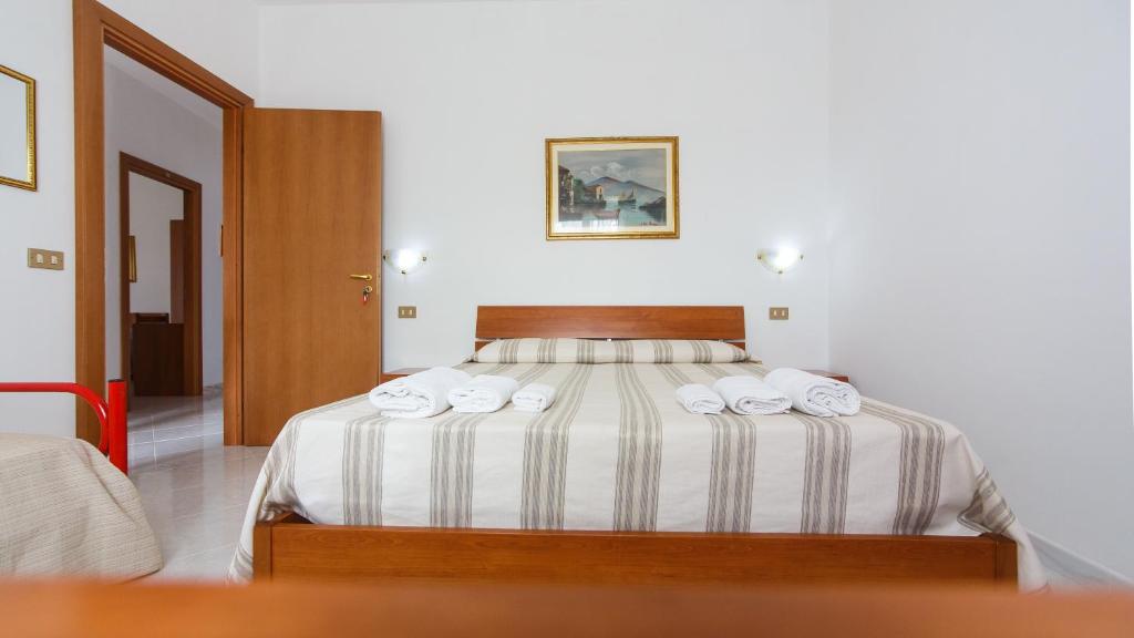 Giường trong phòng chung tại Casa Vacanze L'Orizzonte