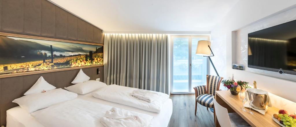 Postel nebo postele na pokoji v ubytování Parc Hotel Am See