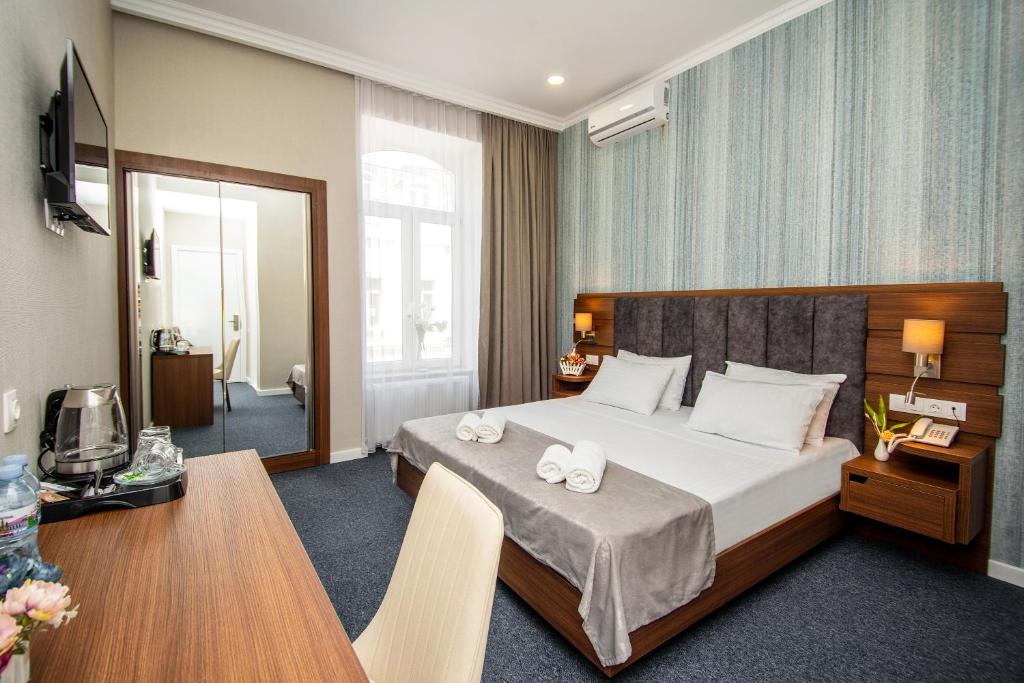Postel nebo postele na pokoji v ubytování Margi Boutique Hotel by DNT Group