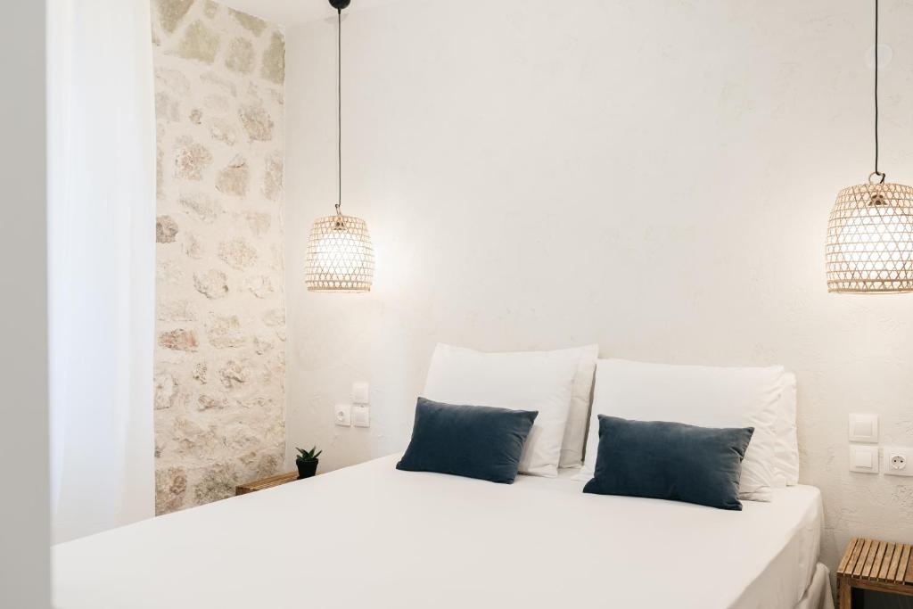 Postel nebo postele na pokoji v ubytování BOĒM Boutique Hotel Lefkada