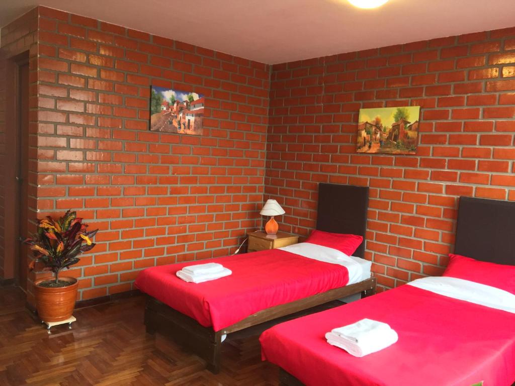 Postel nebo postele na pokoji v ubytování Miraflores Centre