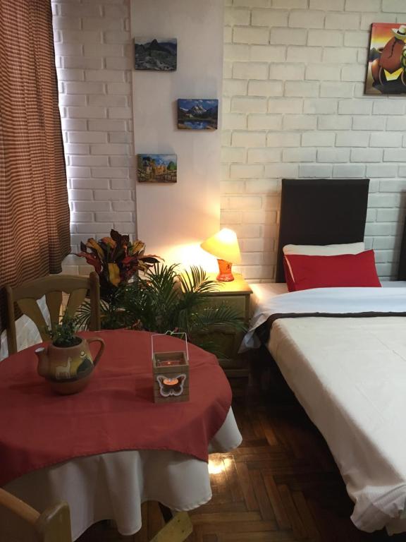 Postel nebo postele na pokoji v ubytování Miraflores Centre