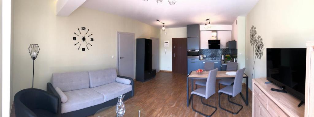 Posedenie v ubytovaní LuxApartament 1 - z widokiem i garażem w nowym Zeta Park