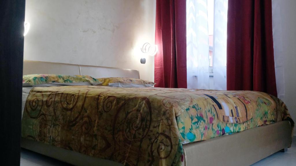 Posteľ alebo postele v izbe v ubytovaní National Gallery Taormina B&B