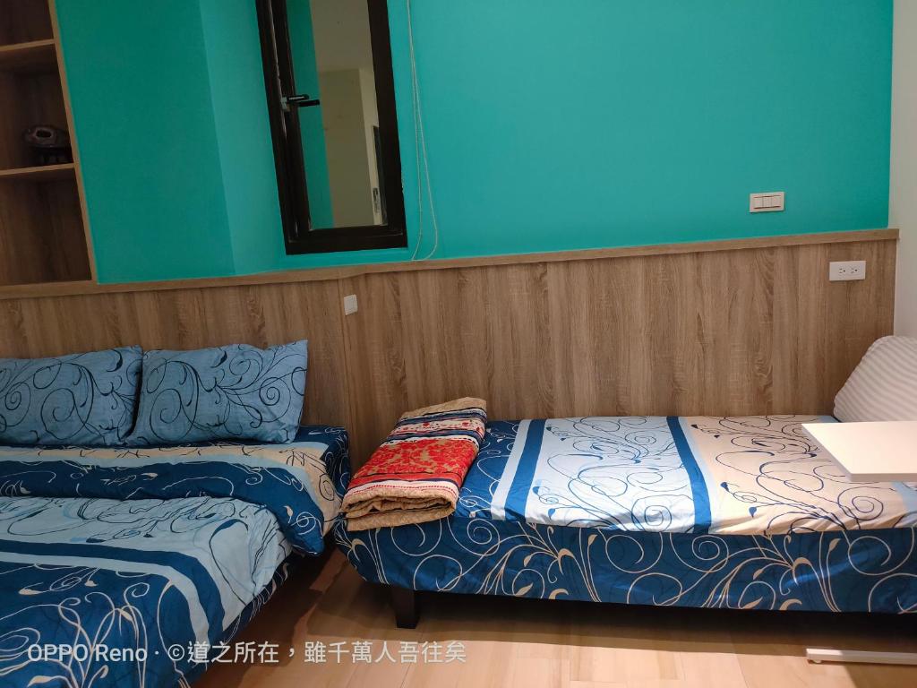 Postel nebo postele na pokoji v ubytování 禾心居He Xin Ju Homestay