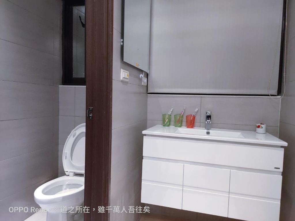 Koupelna v ubytování 禾心居He Xin Ju Homestay