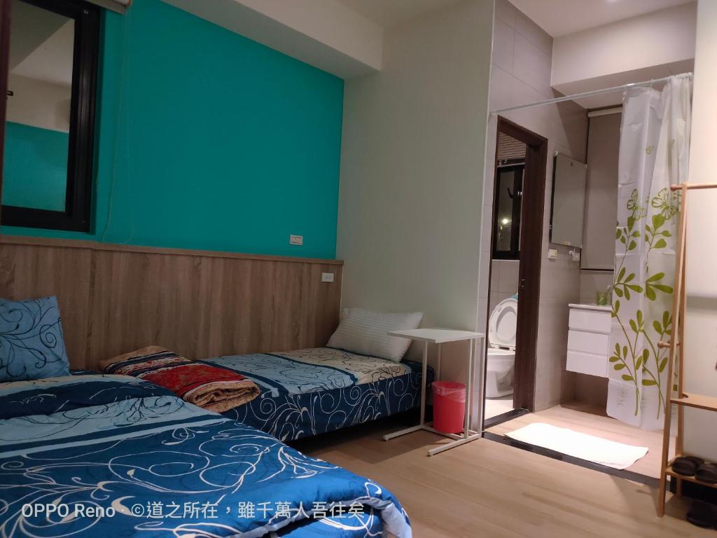 Postel nebo postele na pokoji v ubytování 禾心居He Xin Ju Homestay