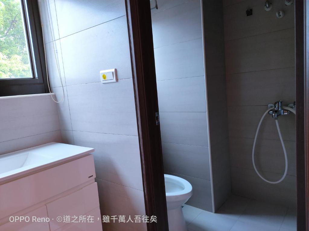 Koupelna v ubytování 禾心居He Xin Ju Homestay