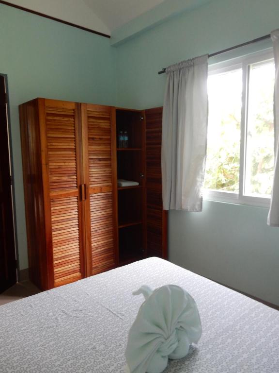 Postel nebo postele na pokoji v ubytování Oslob Seafari Resort