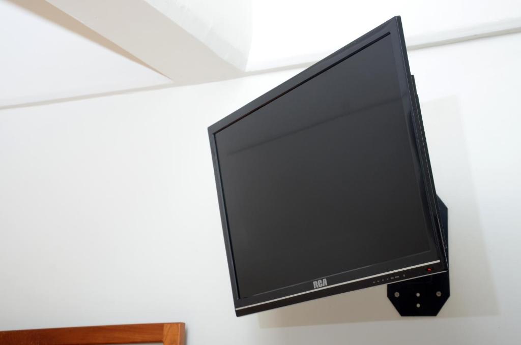 TV a/nebo společenská místnost v ubytování Hotel Delfines - a 2 calles del Acuario Veracruz