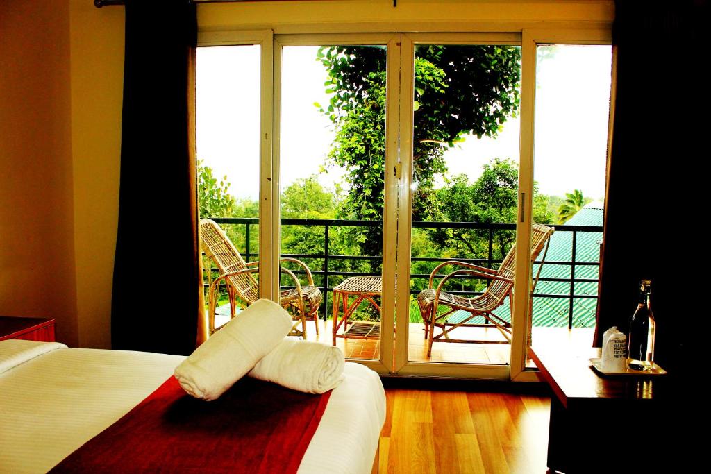 Postel nebo postele na pokoji v ubytování Bellavista Resort Munnar