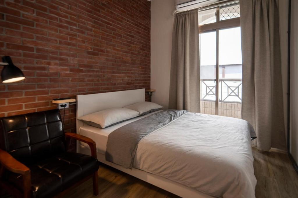 Postel nebo postele na pokoji v ubytování Dongshan Yi Hostel
