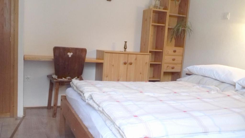 Postel nebo postele na pokoji v ubytování Sobe Odar Andrej