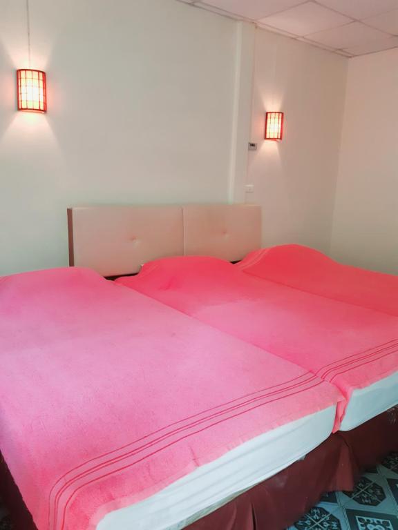 Postel nebo postele na pokoji v ubytování Rai Win Resort