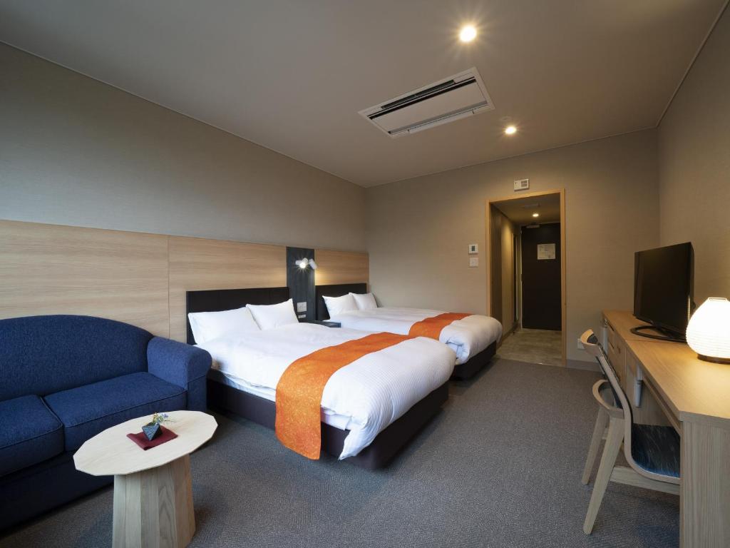 Postel nebo postele na pokoji v ubytování Hotel Sekisuien