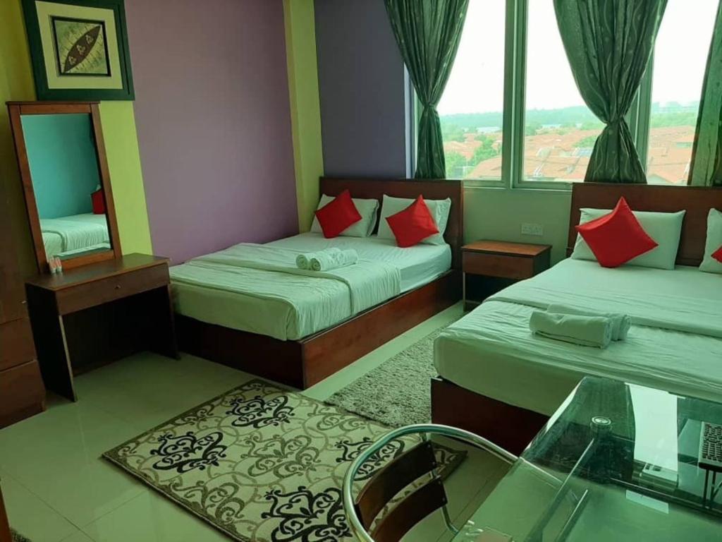 Saujana City Hotel 객실 침대