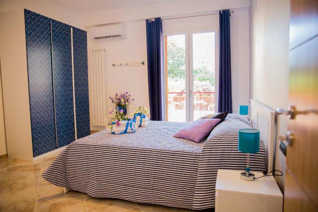 Postel nebo postele na pokoji v ubytování Stella di Mare - Via Amendola