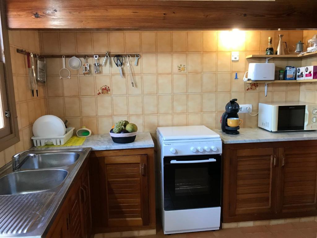 Kuchyň nebo kuchyňský kout v ubytování Can Andreu Morna