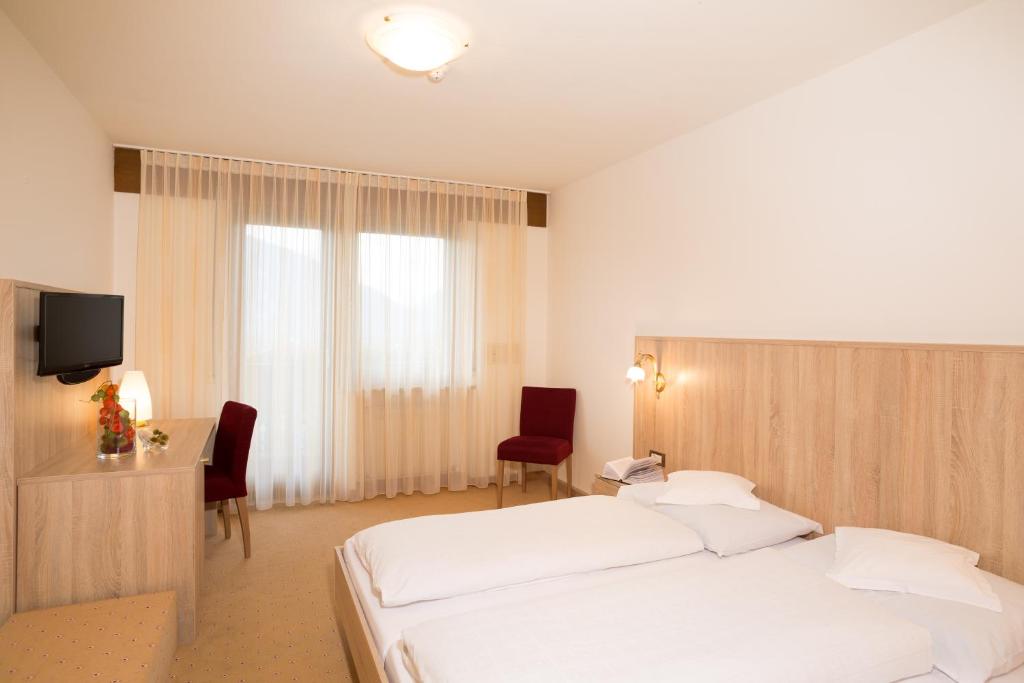 Posteľ alebo postele v izbe v ubytovaní Hotel-Garni Appartement Gartenheim