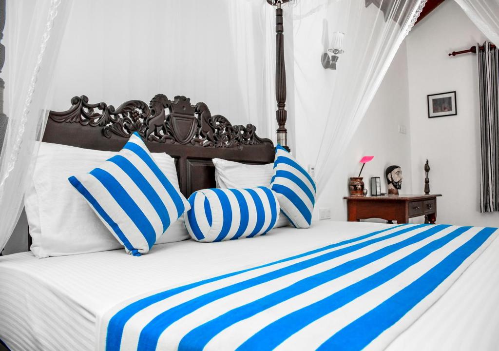 Postel nebo postele na pokoji v ubytování Araliya Gardens Hotel