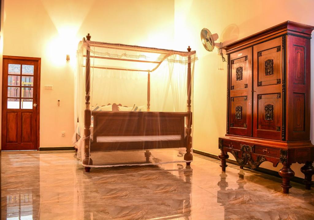 Postel nebo postele na pokoji v ubytování Araliya Gardens Hotel