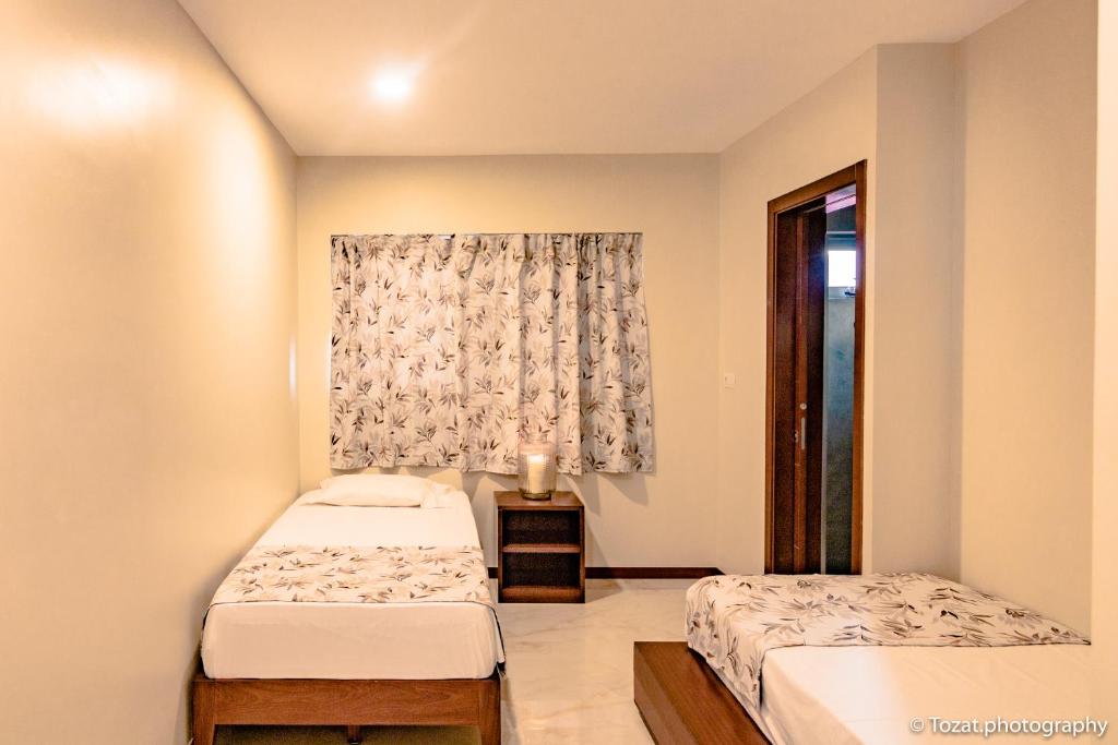 Postel nebo postele na pokoji v ubytování Angulo House