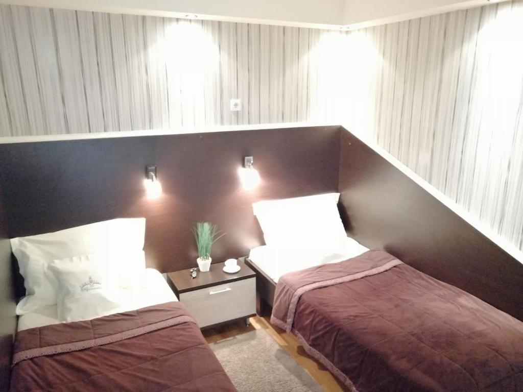 Posteľ alebo postele v izbe v ubytovaní Fortress Apartments