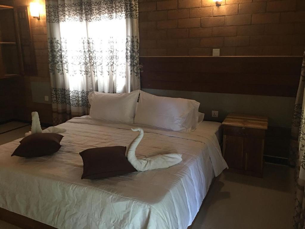 Postel nebo postele na pokoji v ubytování Aki Villa
