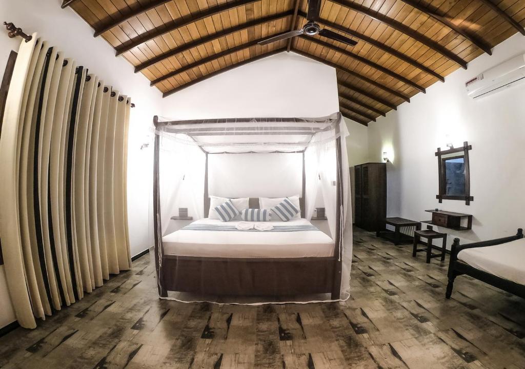 Postel nebo postele na pokoji v ubytování Araliya Gardens Hotel