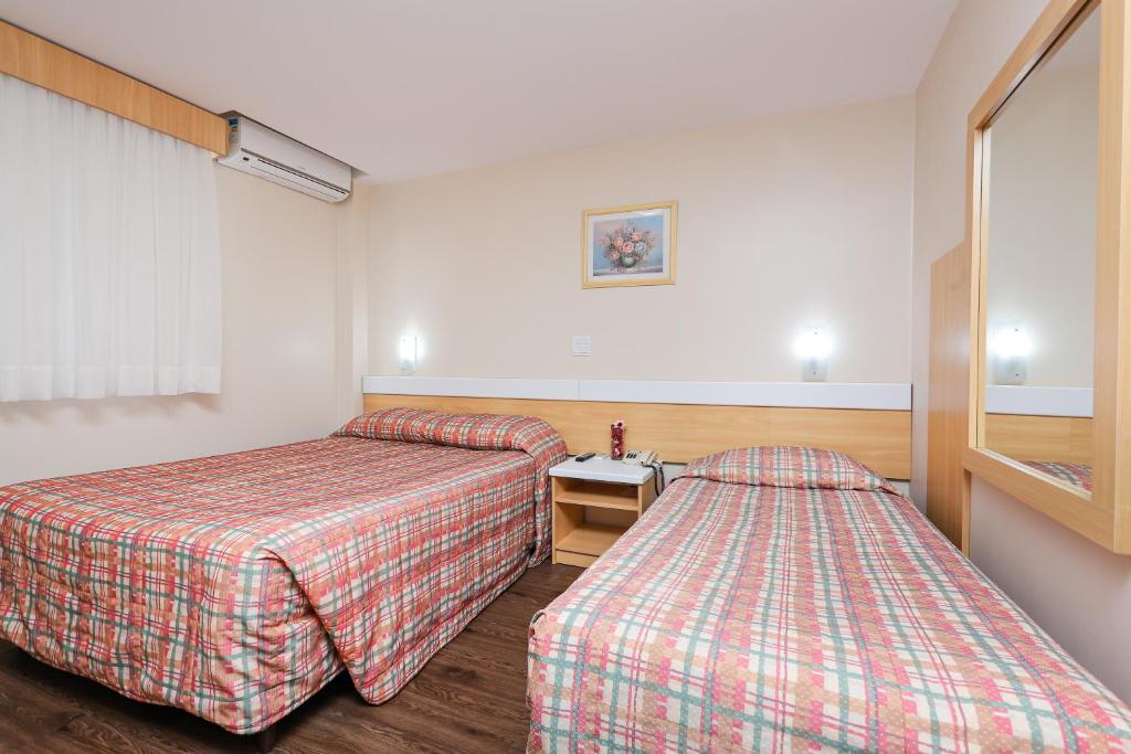 Postel nebo postele na pokoji v ubytování Hotel Express Terminal Tur - Rodoviária Porto Alegre