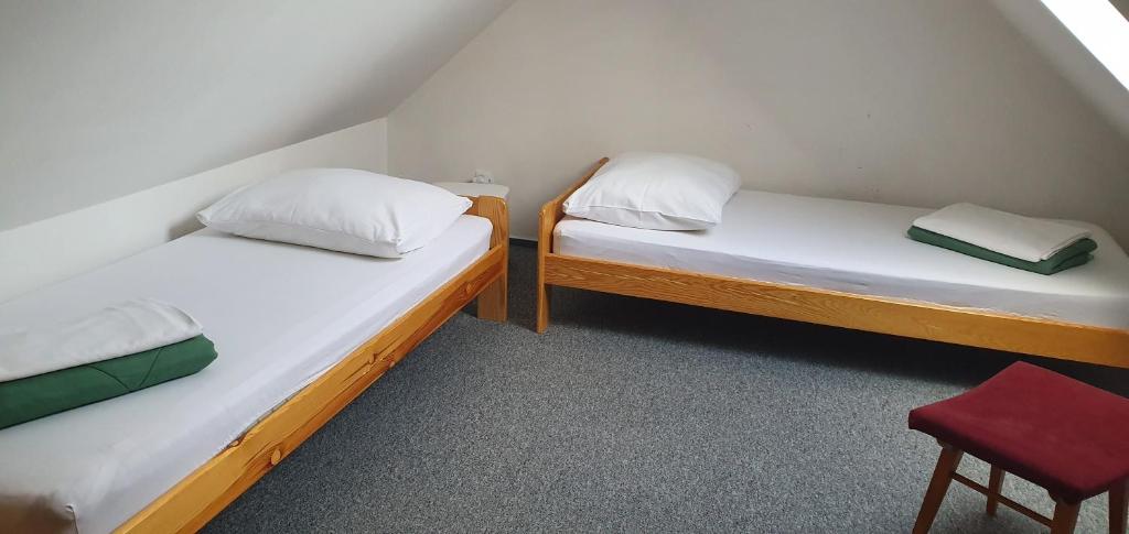 Postel nebo postele na pokoji v ubytování Penzion Dolní Dunajovice