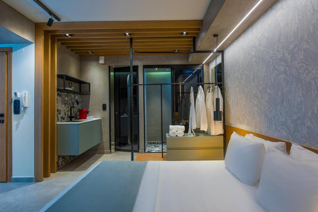 Posteľ alebo postele v izbe v ubytovaní King's Blue, Urban Suites