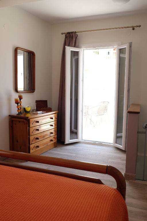 Postel nebo postele na pokoji v ubytování Kalderimi Home