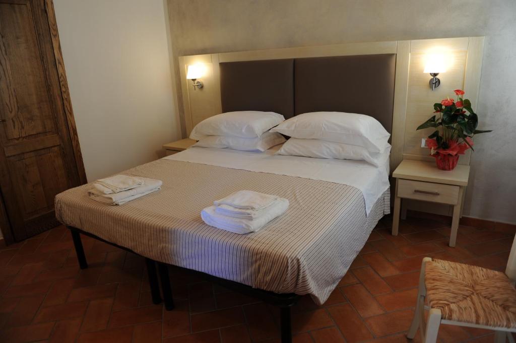 A bed or beds in a room at Super Relais Stella