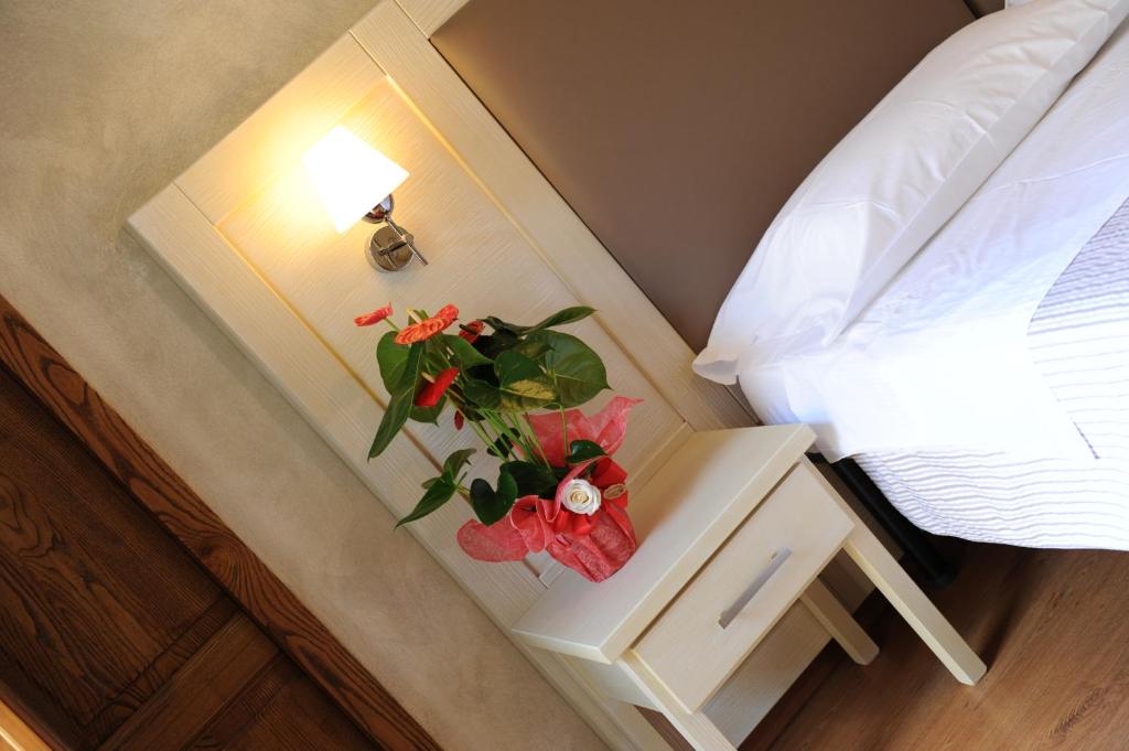 A bed or beds in a room at Super Relais Stella