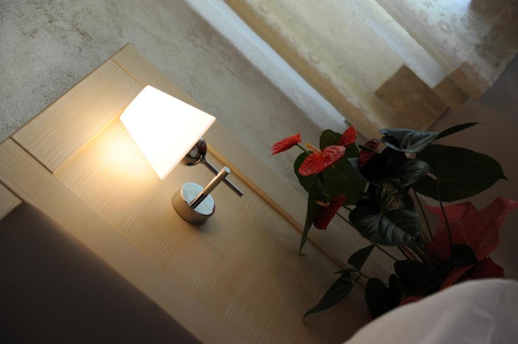 A bed or beds in a room at Super Relais Stella