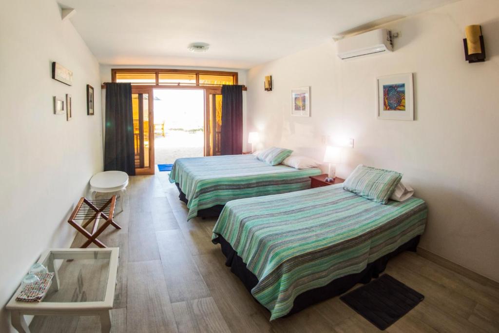 Postel nebo postele na pokoji v ubytování The Isabela Beach House
