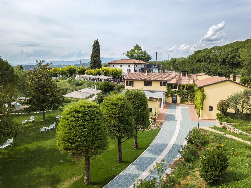 an aerial view of a estate with trees and a road at Cà Toresele Relais Osteria Garden in Verona